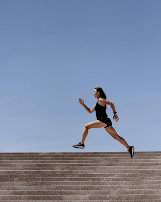 a woman running staying energized