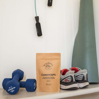 cordyceps mushroom powder beside workout gear